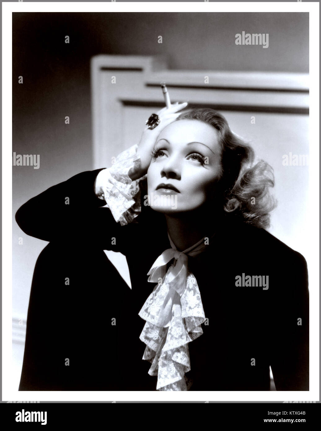 MARLENE DIETRICH Vintage Hollywood film studio soft focus romantic portrait  of Marlene Dietrich, smoking a cigarette, in the 1930's (27 December 1901 –  6 May 1992 Stock Photo