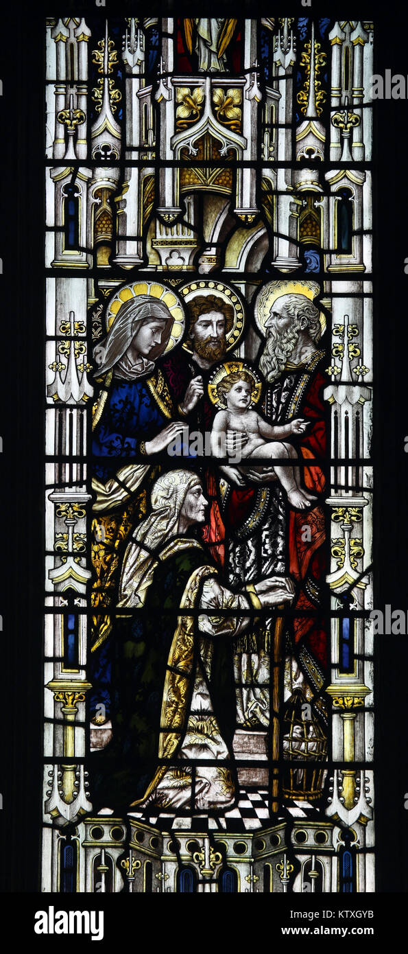 Stained glass window by Powell & Sons depicting Presentation of Jesus in the temple, St Mary's Church, Stratford St Mary, Suffolk, England; Pre Stock Photo