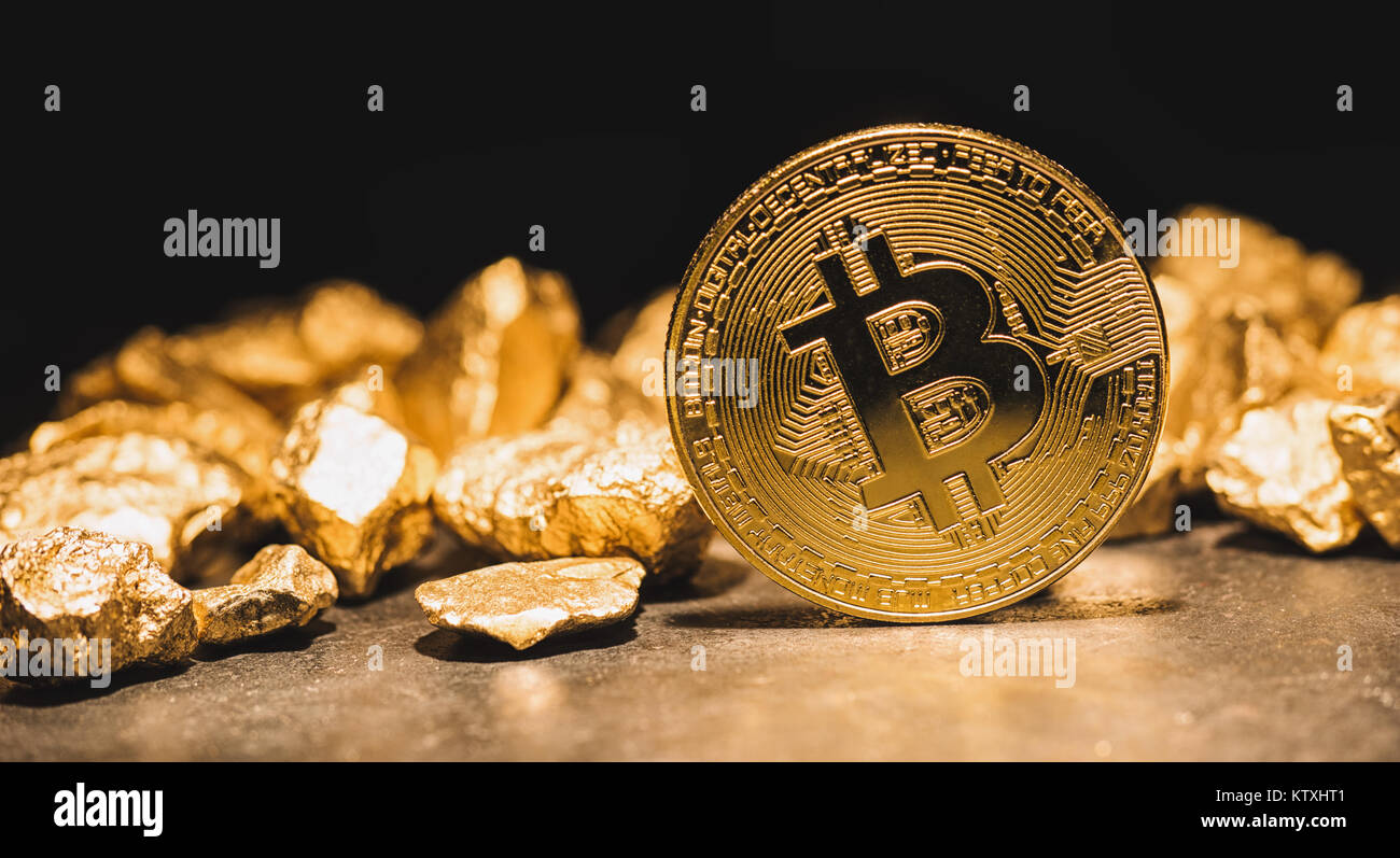 cryptocurrency Bitcoin and mound of gold nuggets - Business concept image Stock Photo