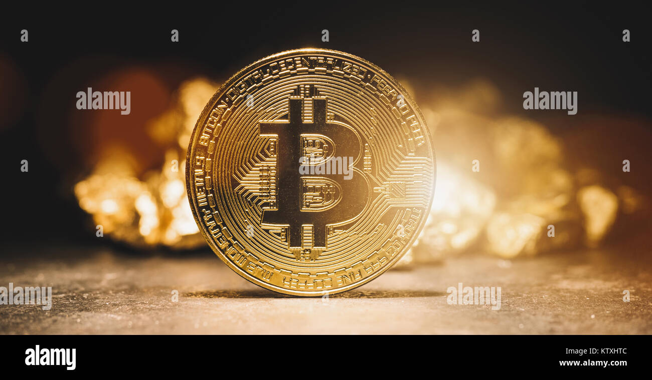 cryptocurrency Bitcoin and mound of gold - Business concept image Stock Photo