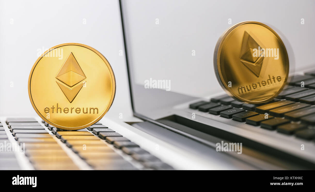ethereum coin - Digital cryptocurrency on notebook Stock Photo