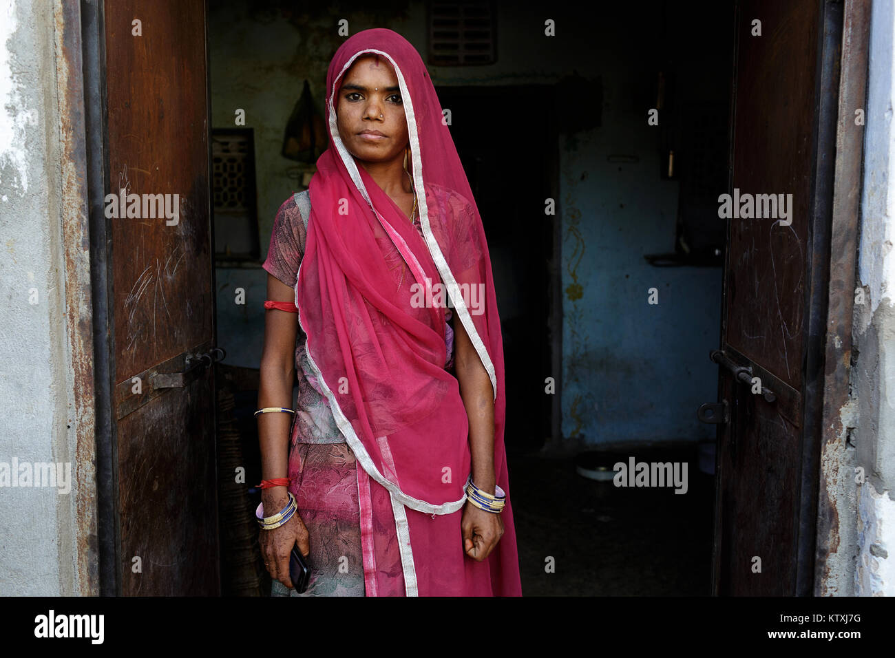 Portrait of young indian woman wearing sari and a veil over her hair in her  home, village near Pushkar, Rajasthan, India Stock Photo - Alamy