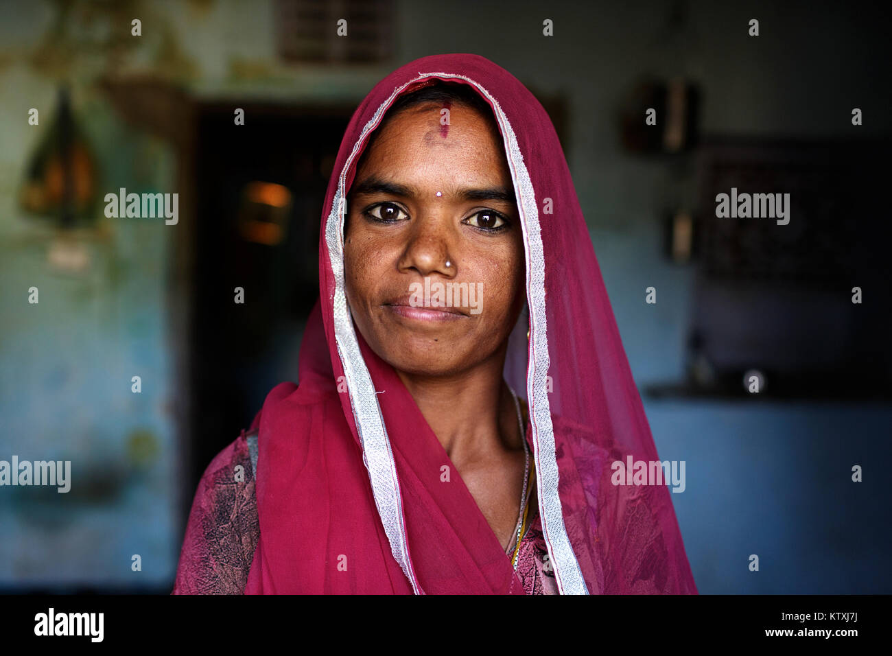 Portrait of young indian woman wearing sari and a veil over her hair in ...