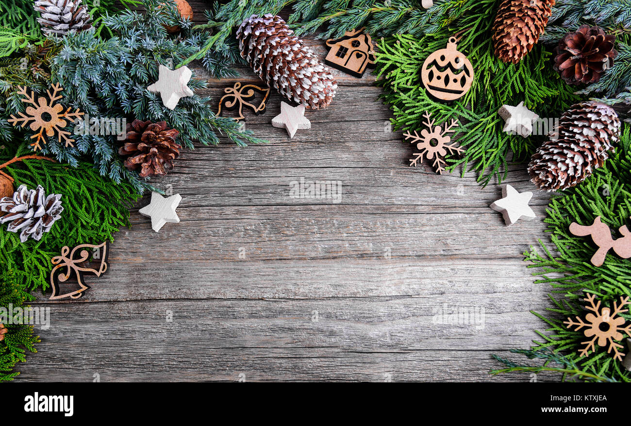 Christmas tree and nuts on wooden boards. Stock Photo