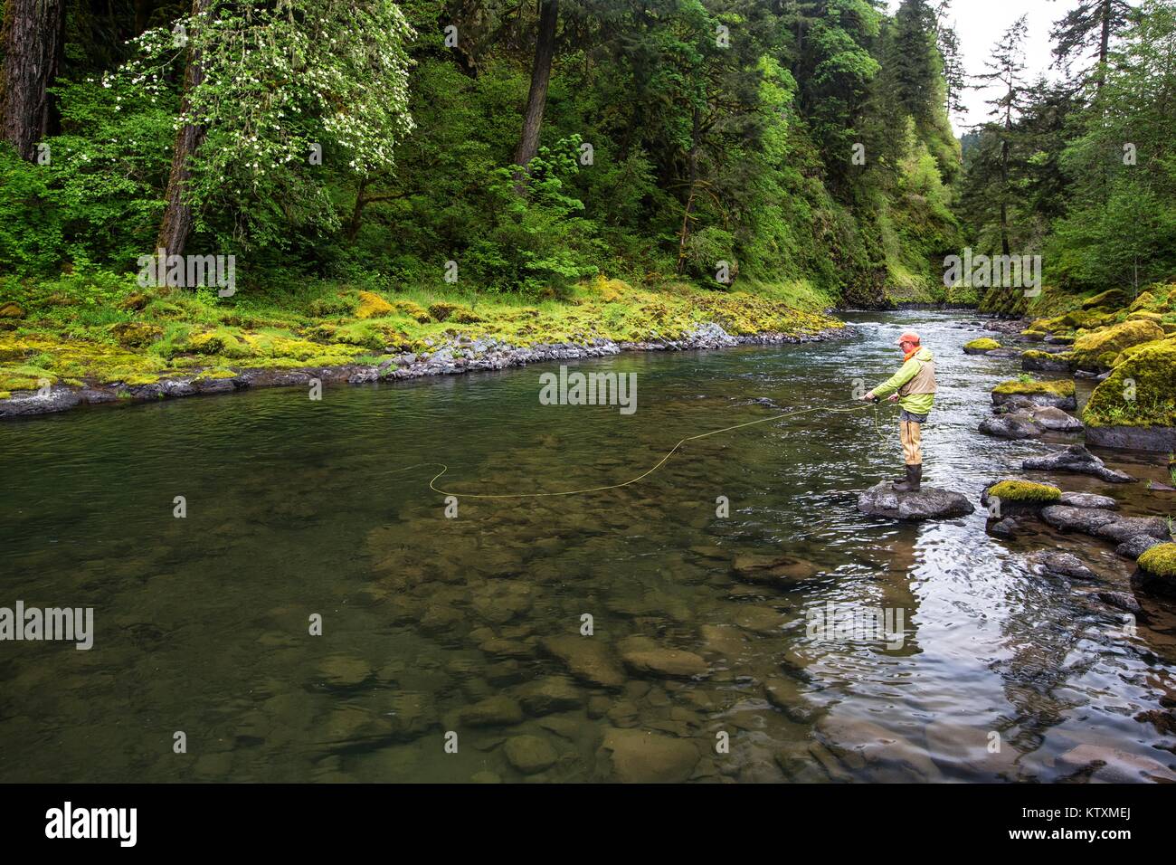 A fisherman fishes on the Molalla Recreational River in the Molalla River Recreation Area May 12