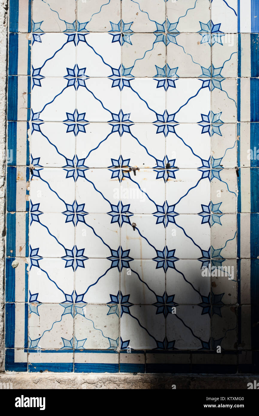 Portuguese azulejo ceramic tiles with a floral pattern, decorate the external walls of a building in Lisbon, Portugal. Stock Photo