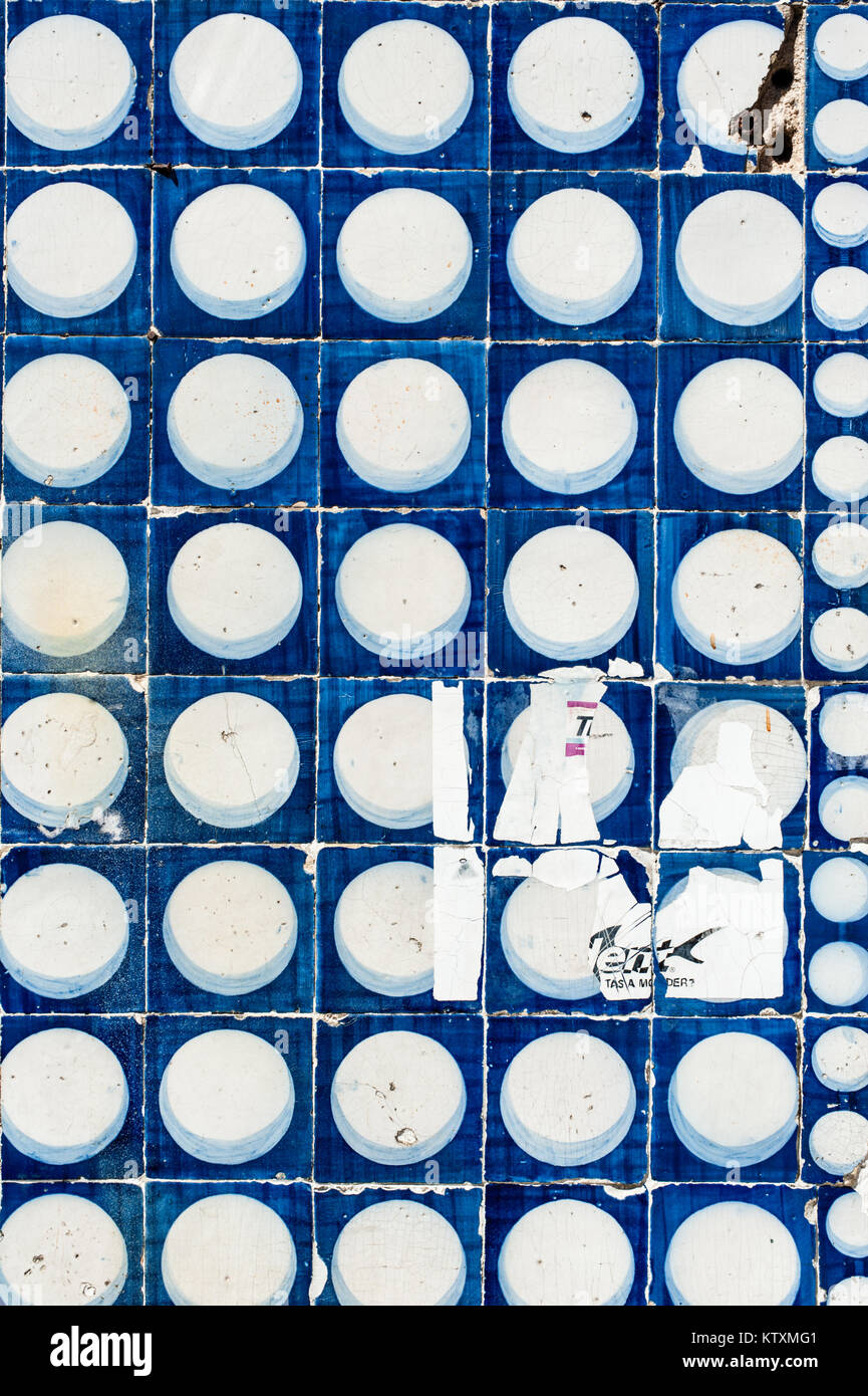 Portuguese azulejo ceramic tiles with a circular pattern, decorate the external walls of a building in Lisbon, Portugal. Stock Photo