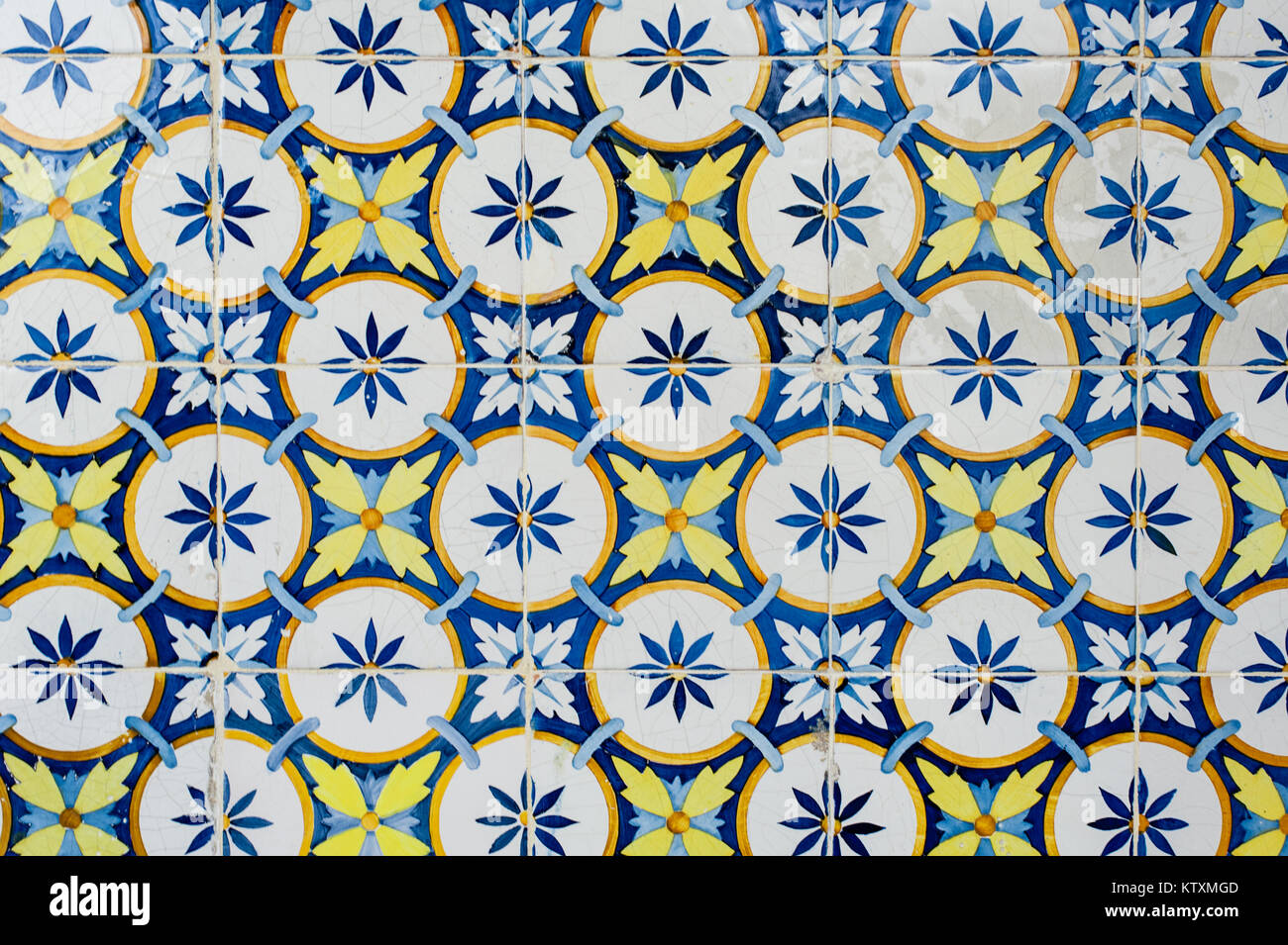 Portuguese azulejo ceramic tiles with a circular, floral pattern, decorate the external walls of a building in Lisbon, Portugal. Stock Photo