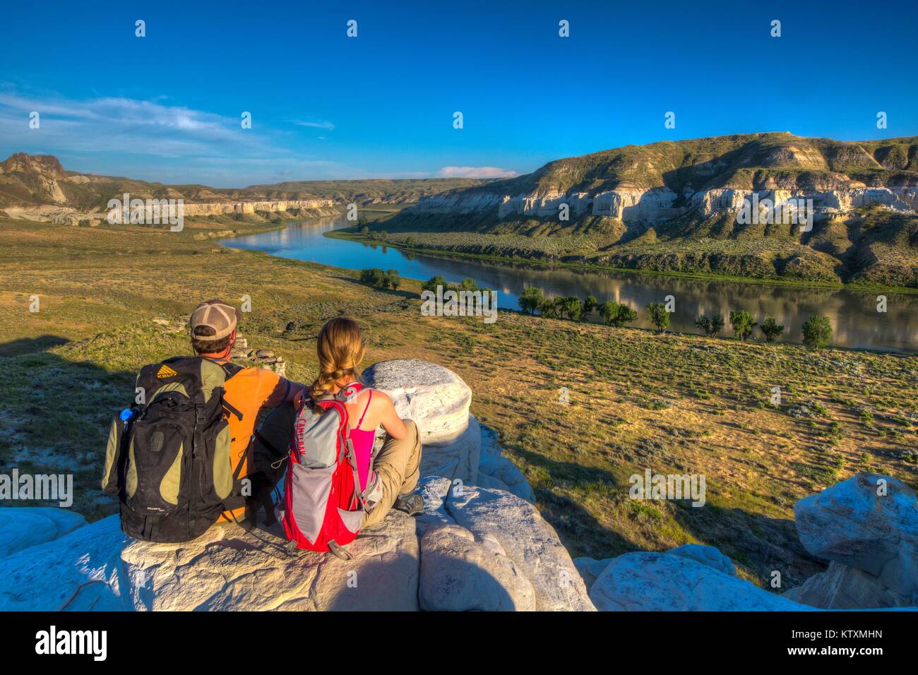 Hikers look out on the Upper Missouri Wild and Scenic River in the Upper Missouri River Breaks National Monument June 27, 2017 near Lewistown, Montana. Stock Photo
