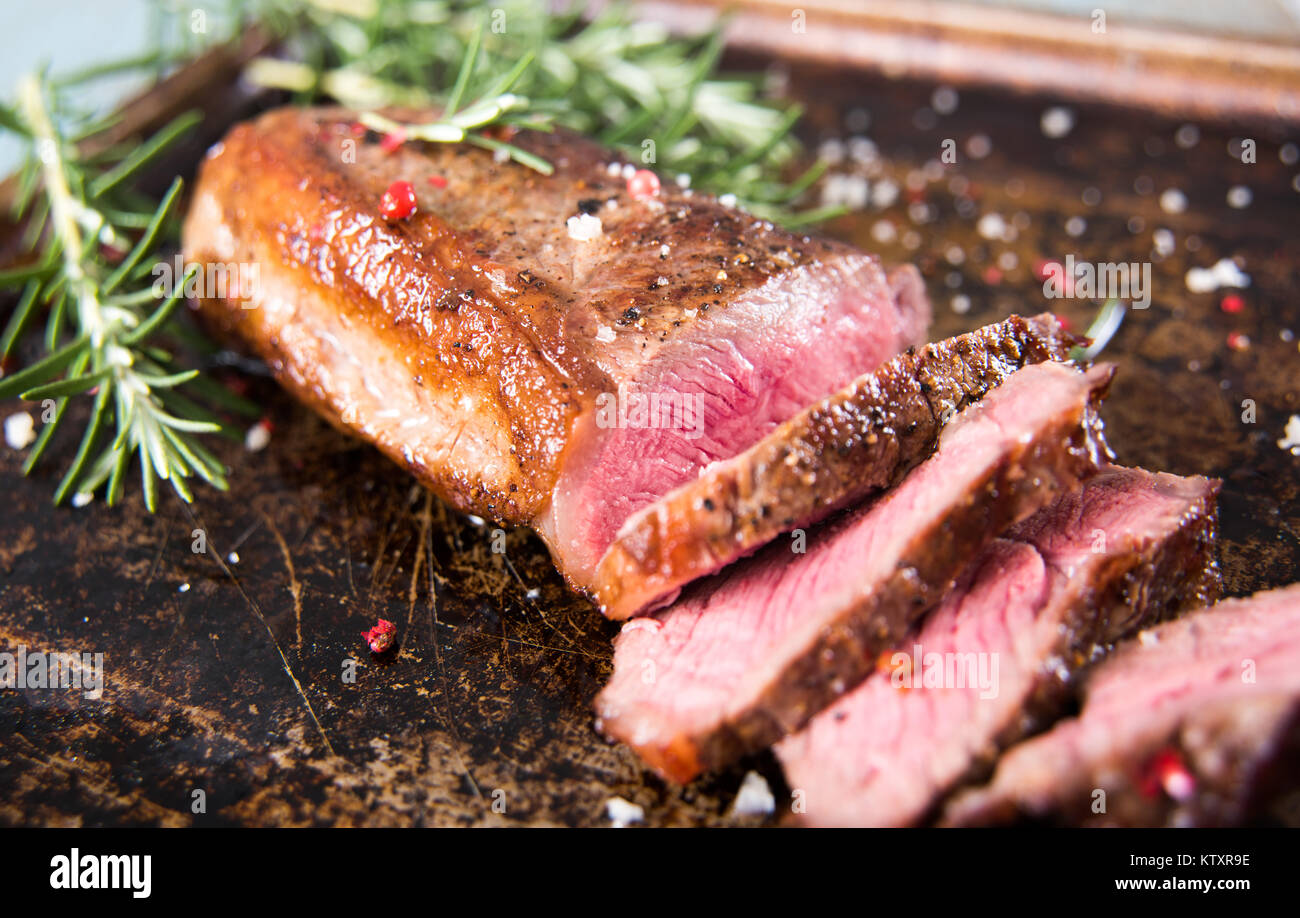Grass Fed Steak Roasted to Medium Rare Stock Photo