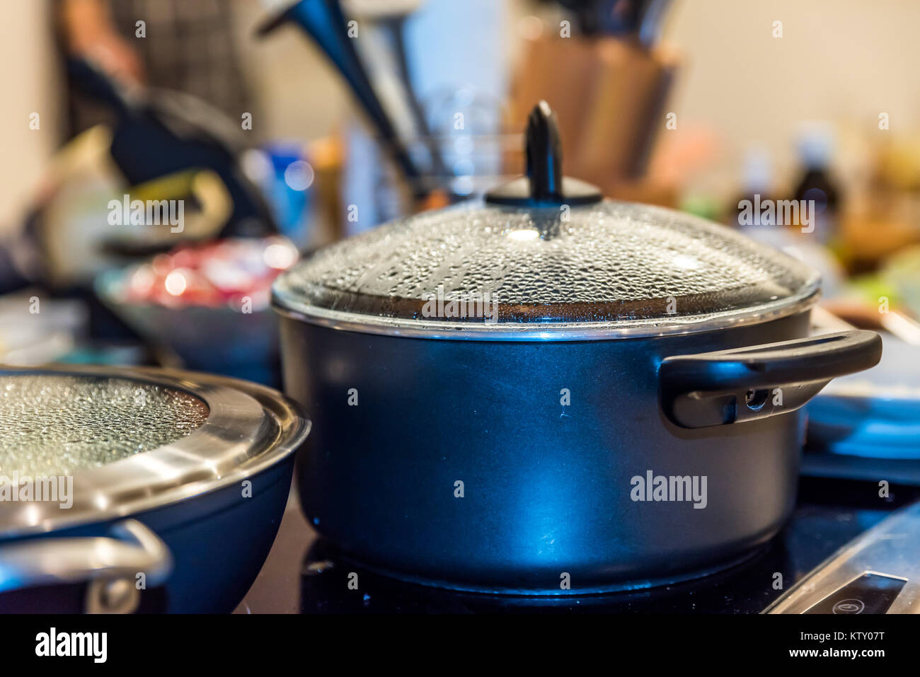 Closeup view misted up pan lid cooking on modern electric cooker Stock