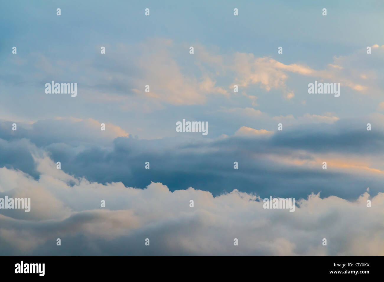 Beautiful cloudscape with blue and gray contrasting clouds during thunderstorm Stock Photo