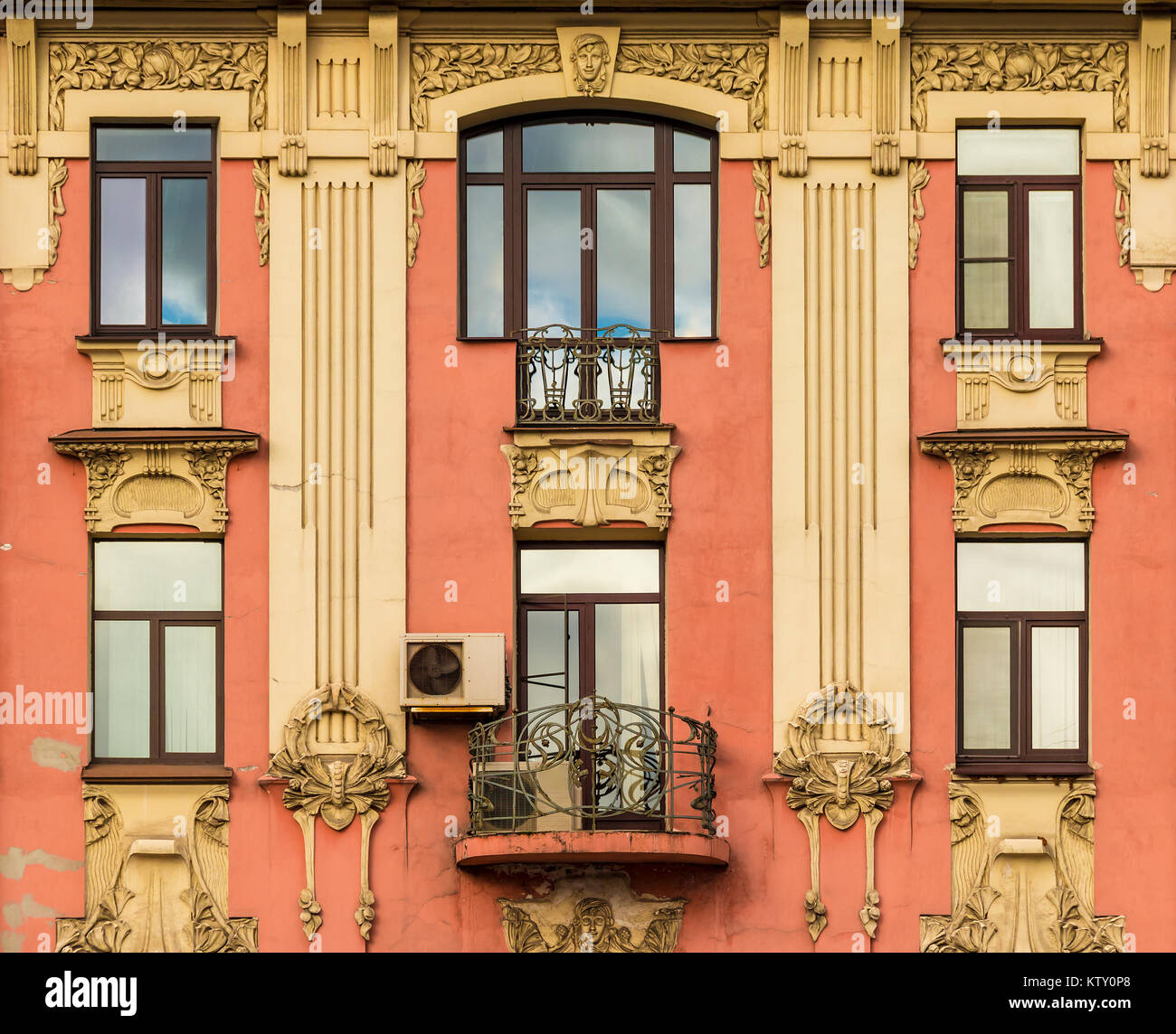 Balcony and several windows in a row on the facade of the urban historic building front view, Saint Petersburg, Russia Stock Photo