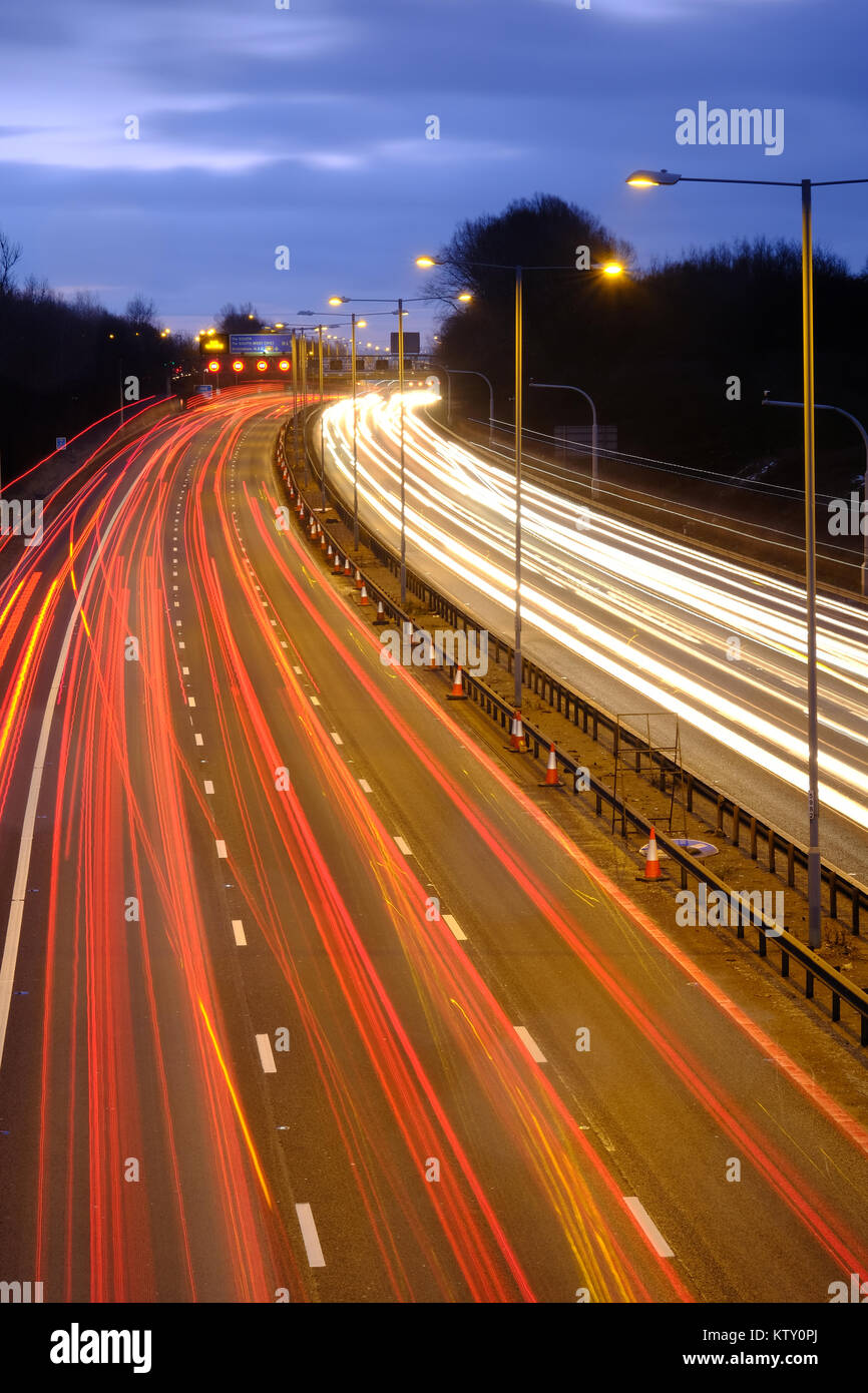 Motorway traffic at dusk on the M6 in the English Midlands Stock Photo