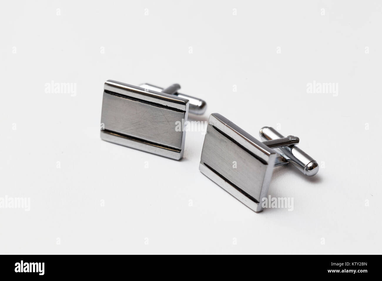 cufflinks silver on white backgrounds, close up Stock Photo