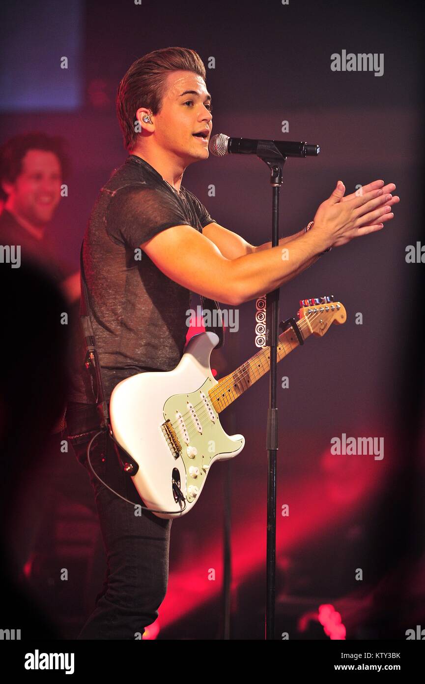 Country music singer Hunter Hayes performs for soldiers during a USO Tour concert at the Royal Air Force Mildenhall October 11, 2014 in Bury Saint Edmunds, England, United Kingdom. Stock Photo