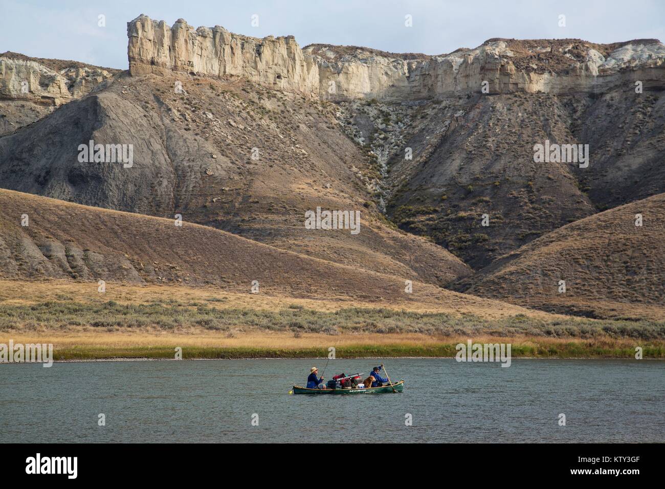 Tourists canoe down the Upper Missouri River National and Scenic River