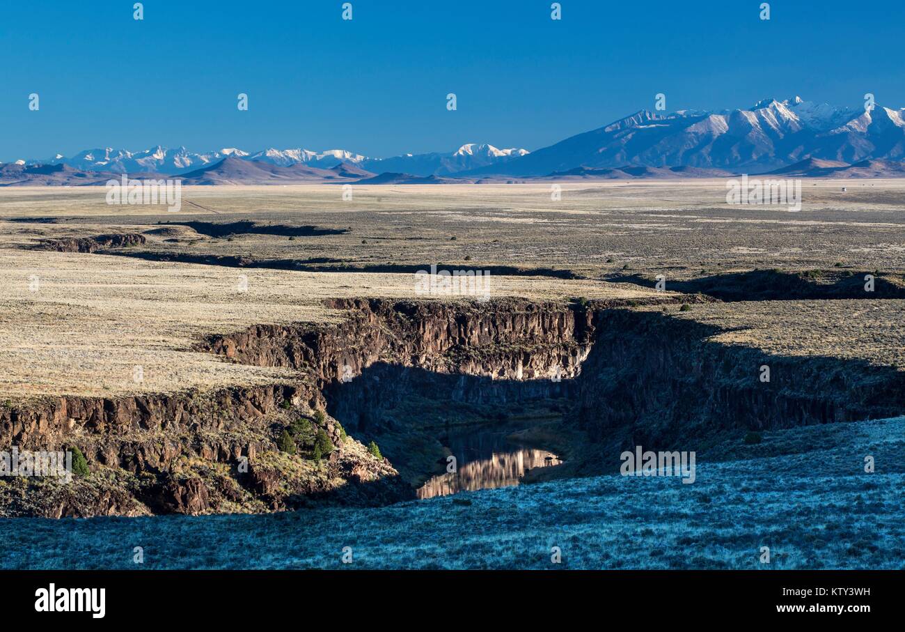 The Rio Grande Wild and Scenic River flows through the snowy Rocky Mountains October 14, 2014 in New Mexico. Stock Photo