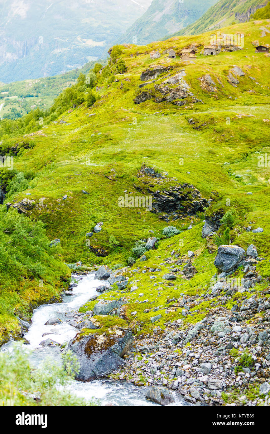 Stream River And Old Country Houses Cabins In The Mountains Stock
