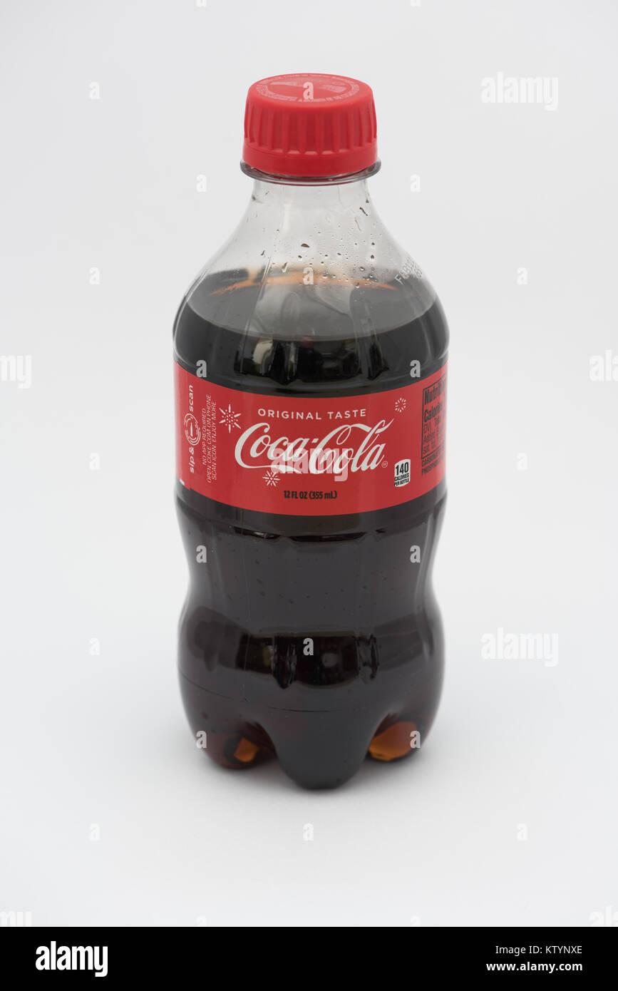 A plastic recyclable 12 ounce bottle of Coca-Cola isolated Stock Photo