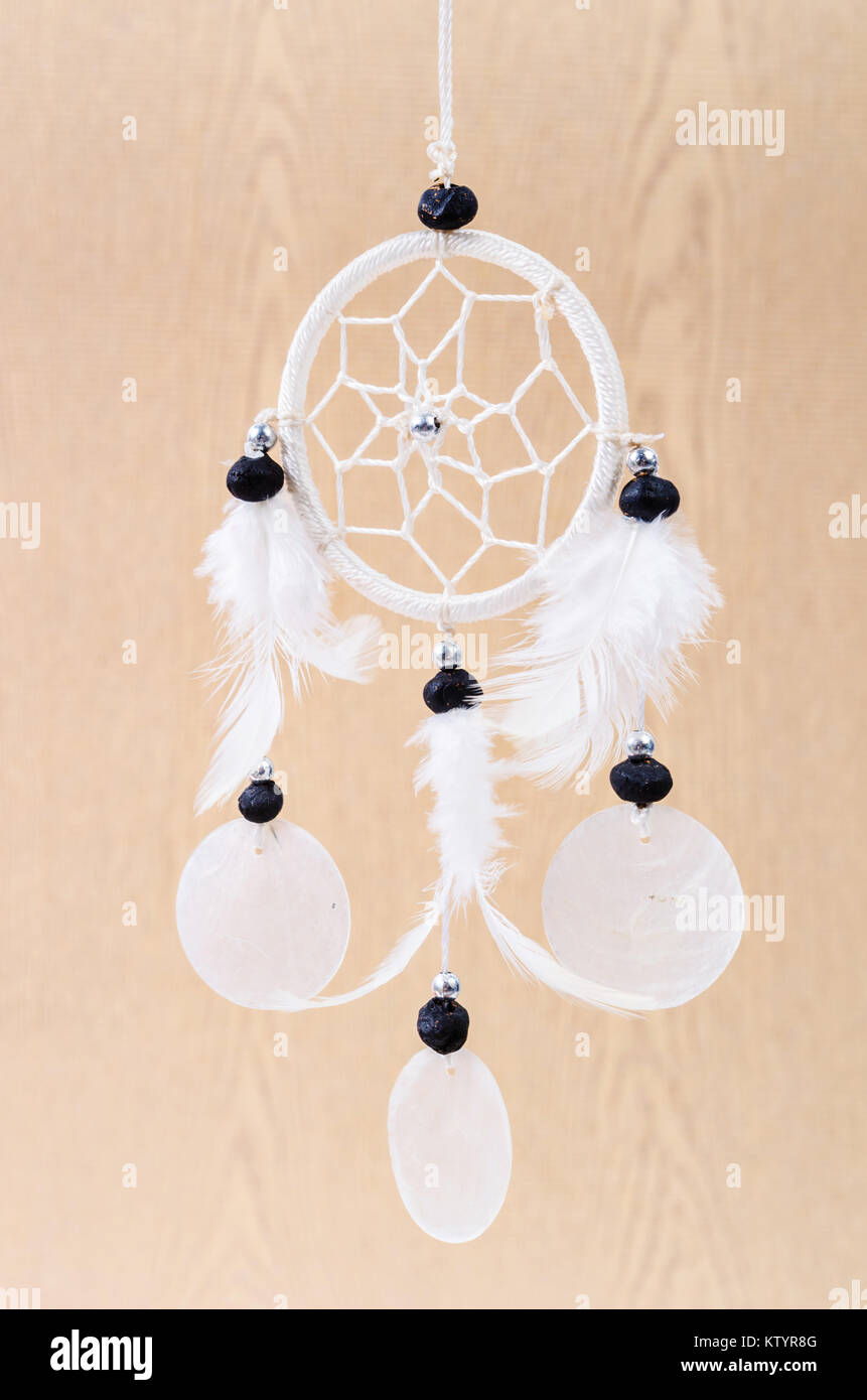 White dream catcher on wooden background Stock Photo Alamy