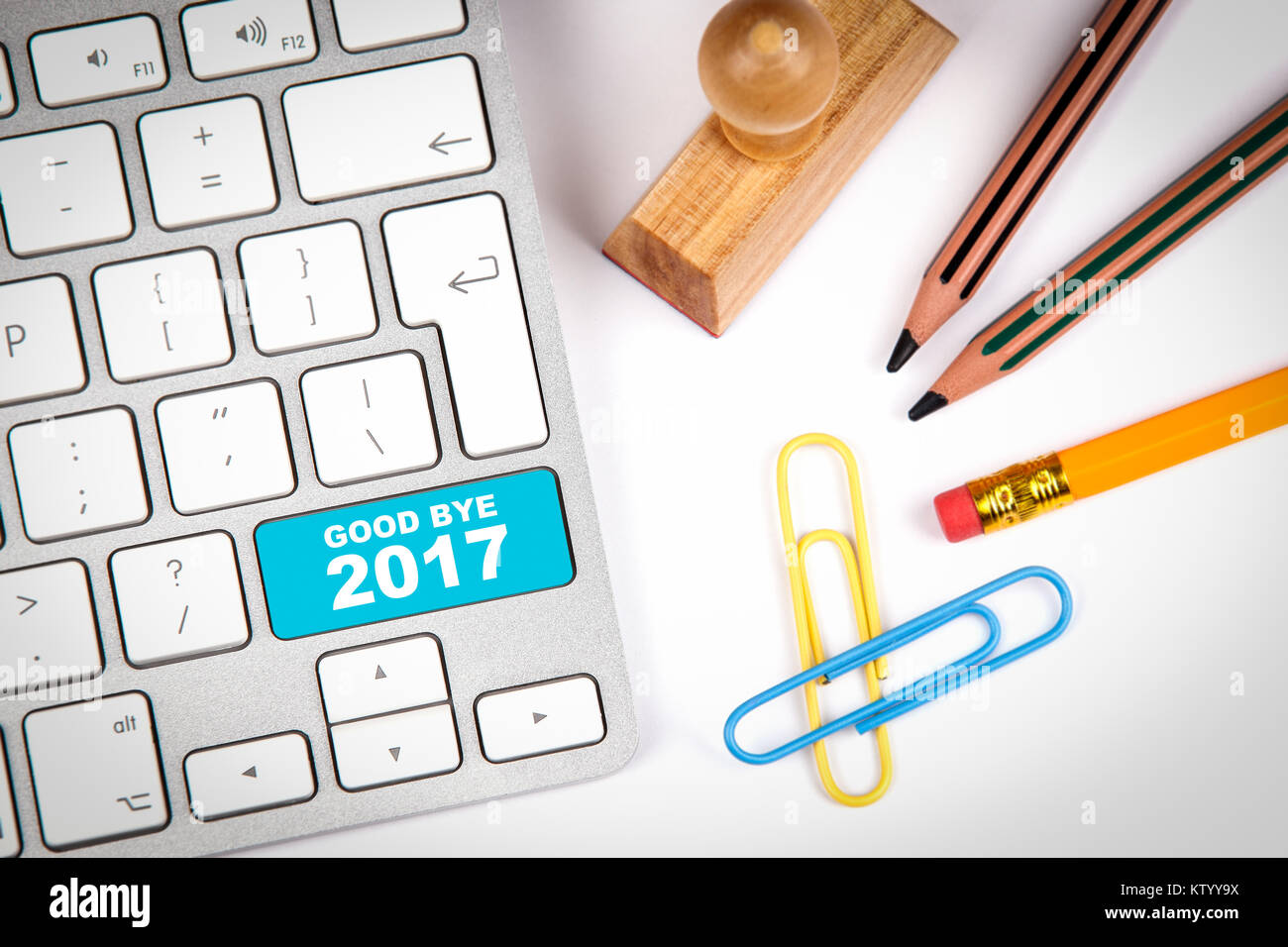 good bye 2017, Business concept. Computer keyboard on a white office desk with various items Stock Photo