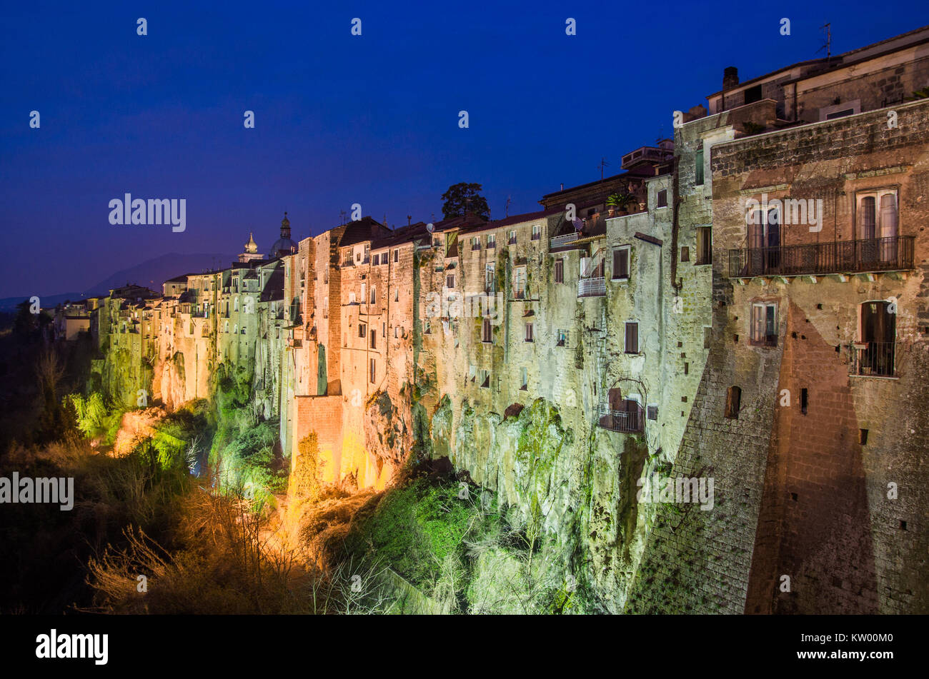 A view of historical small town of Sant Agata de Goti at night with street lights and houses on the cliff. Stock Photo