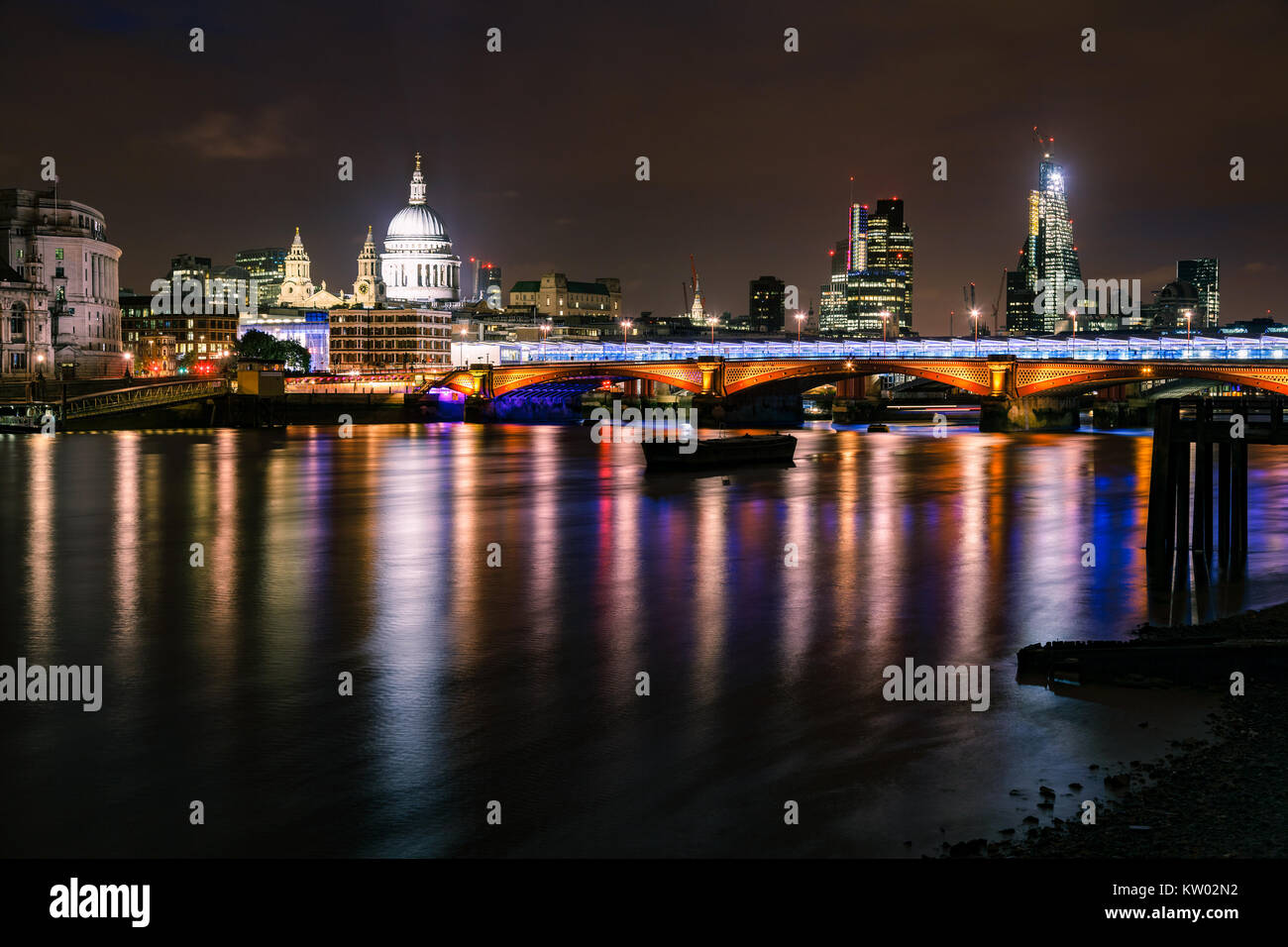 London skyline with illuminated Blackfriars Bridge over the River Thames and The St Paul's Cathedral at night Stock Photo