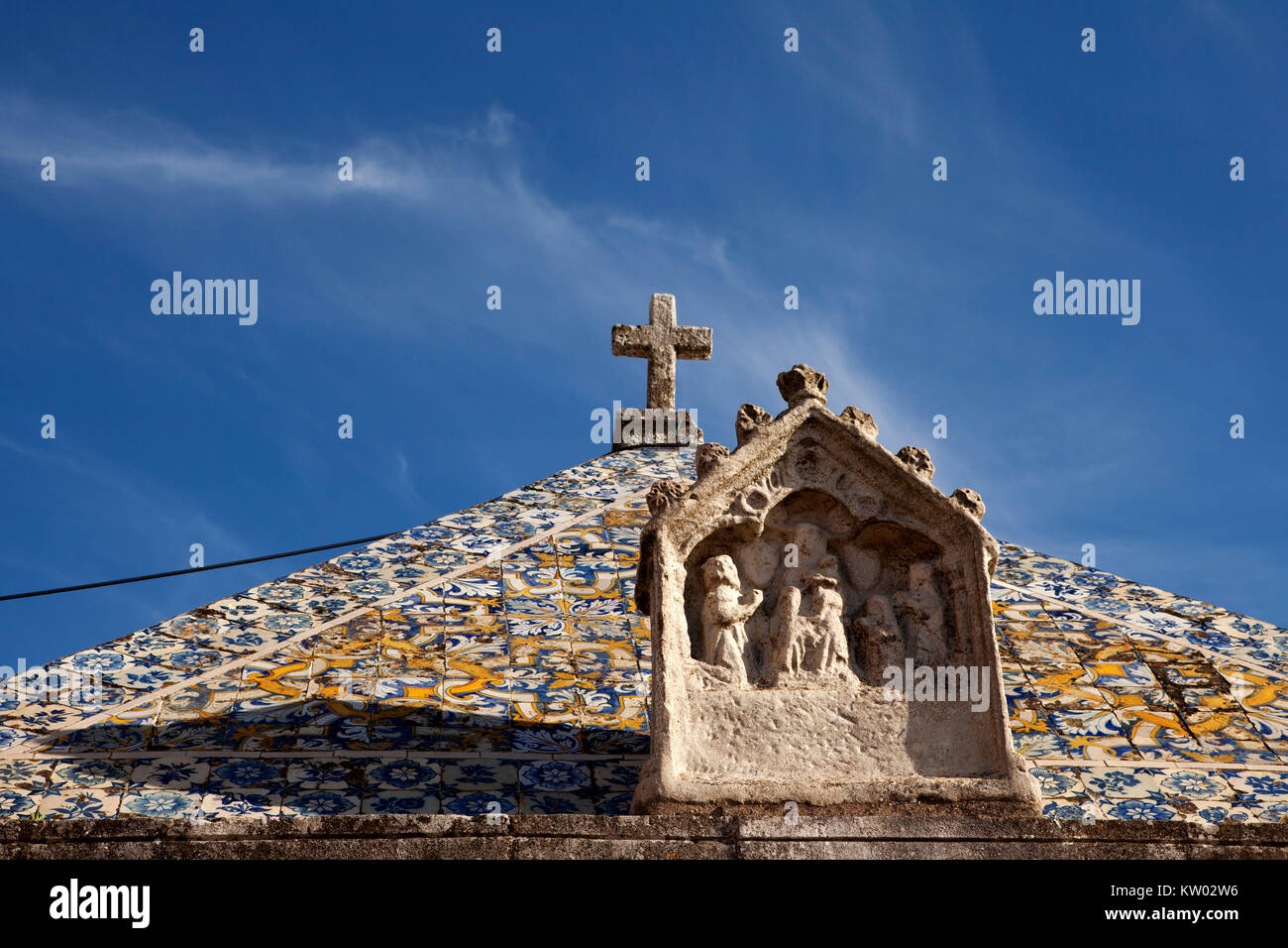 Sculpture on the facade of the Ermida da Memória, a chapel at Nazare in Portugal. The chapel is a Christian place of worship. Stock Photo