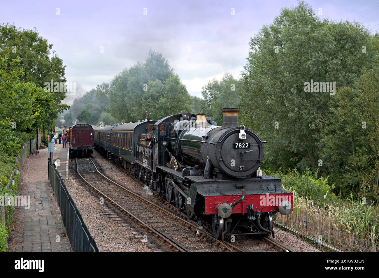 7822 'Foxcote Manor, heads a train from Tenterden passing an up train in the loop at Wittersham Road on the Kent and East Sussex Railway, UK Stock Photo