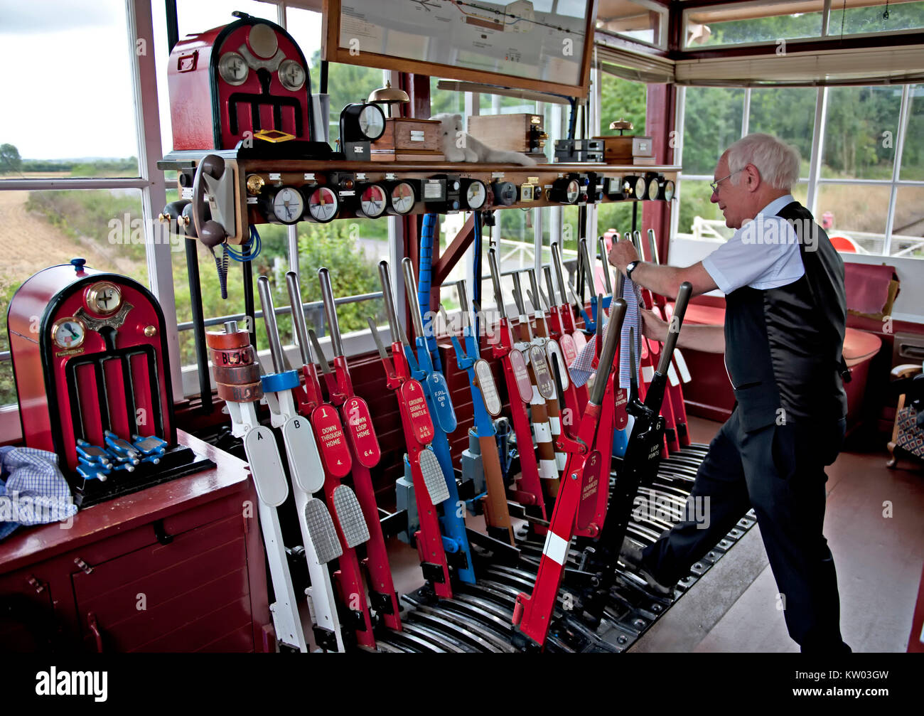 A Signalman at work at Wittersham Road Signalbox on the Kent and East Sussex Railway UK Stock Photo