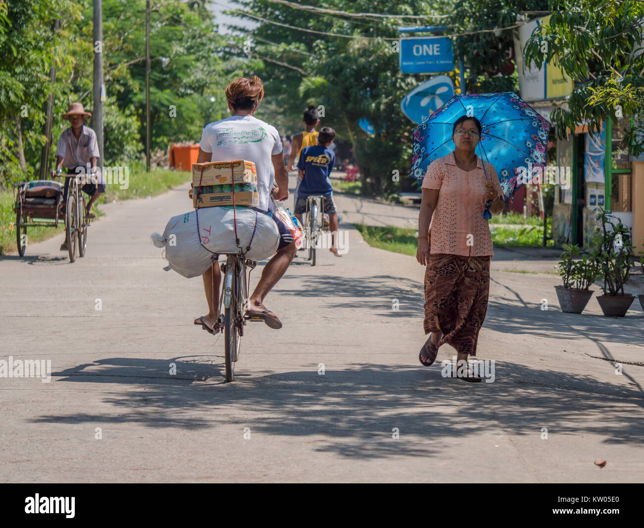 Road with local traffic in Dala Township, across the Yangon River from Yangon. Stock Photo