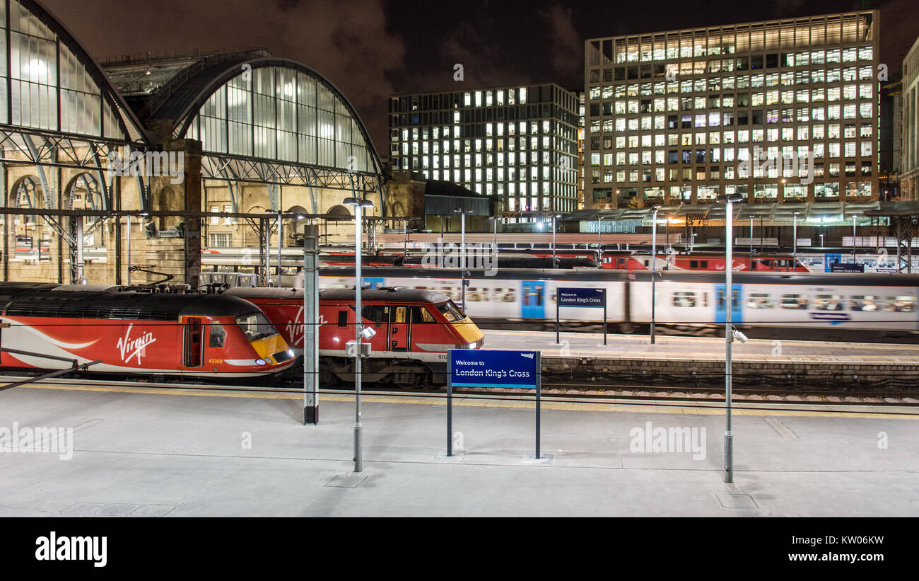 London, England, UK - February 1, 2016: Virgin Trains East Coast Intercity 125 and Intercity 225 trains wait at platforms at London's King's Cross rai Stock Photo