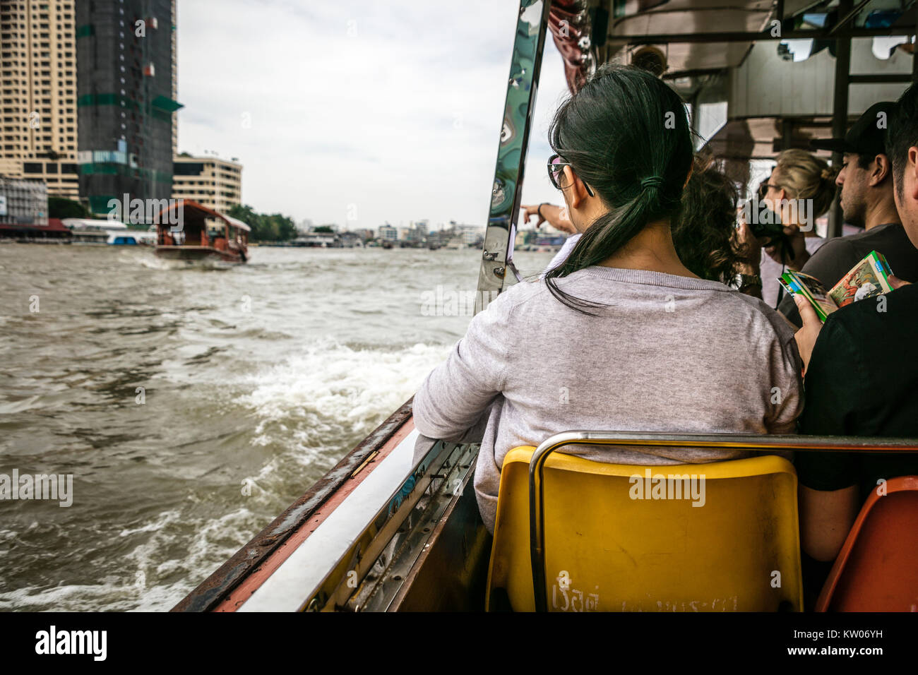 Tourists on ferry boat, Chao Phraya River, Bangkok, Thailand. Stock Photo
