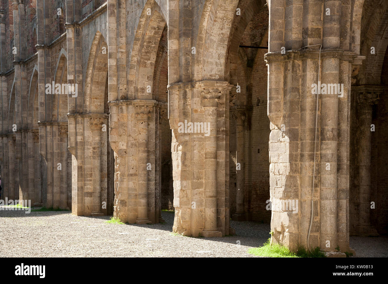 Ruined Italian Gothic Abbazia di San Galgano (Abbey of San Galgano) from XIII century was one of the richest and most powerful monasteries in XIII and Stock Photo