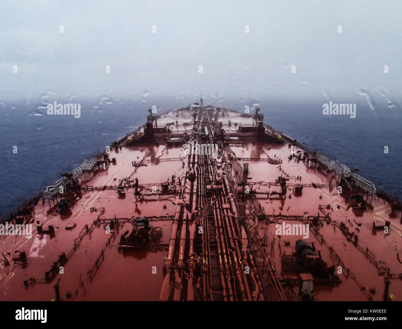 An oil tanker sailing in the Indian ocean in a rainy day Stock Photo