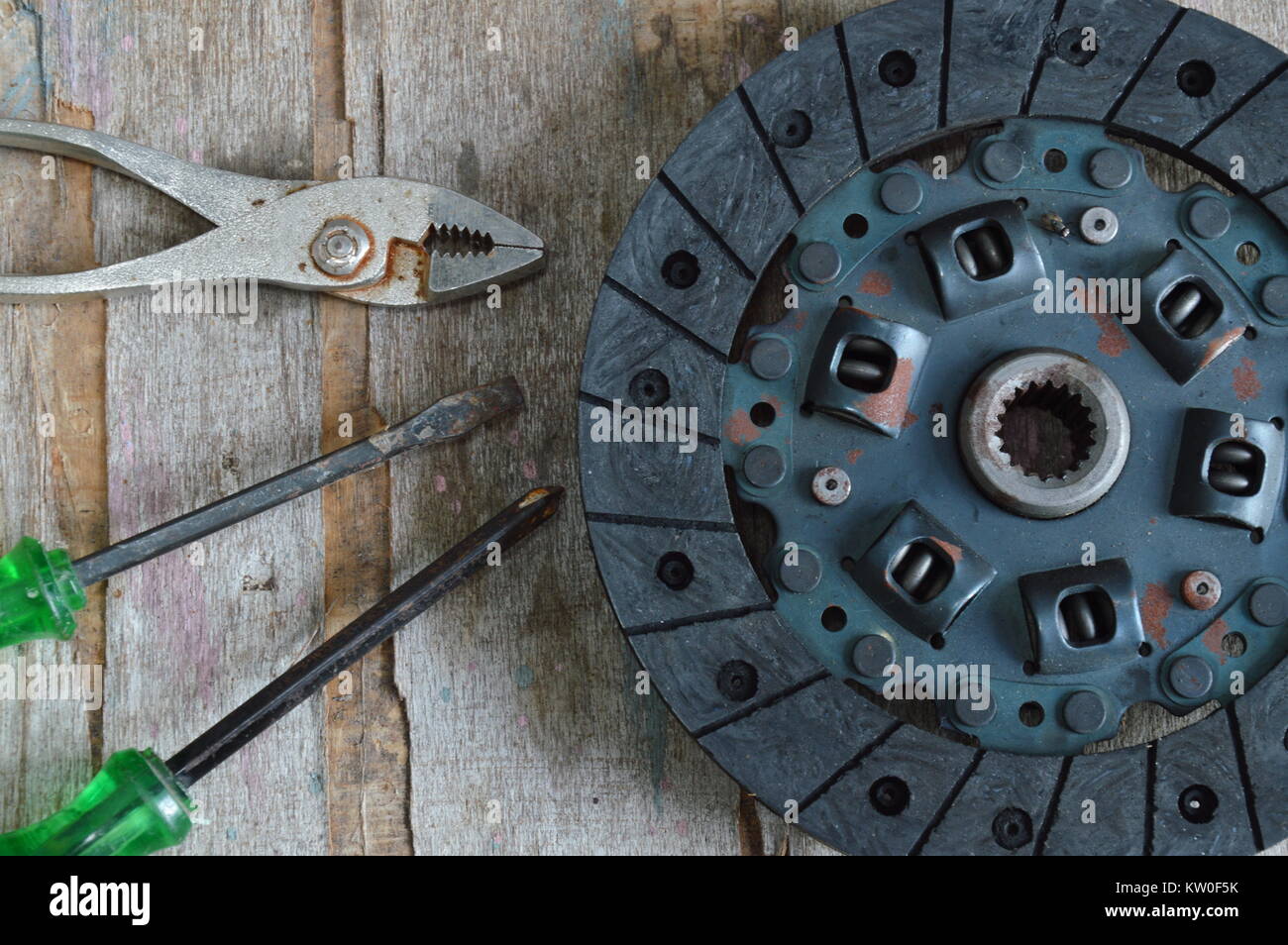 broken engine clutch on wood board Stock Photo Alamy