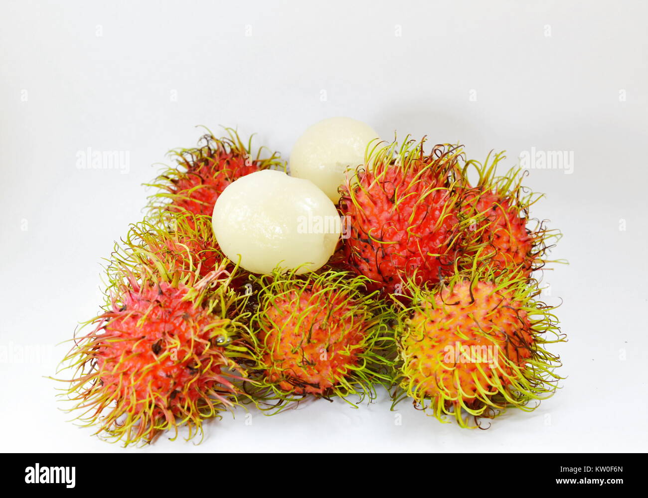 rambutan tropical fruit peel out on white background Stock Photo - Alamy