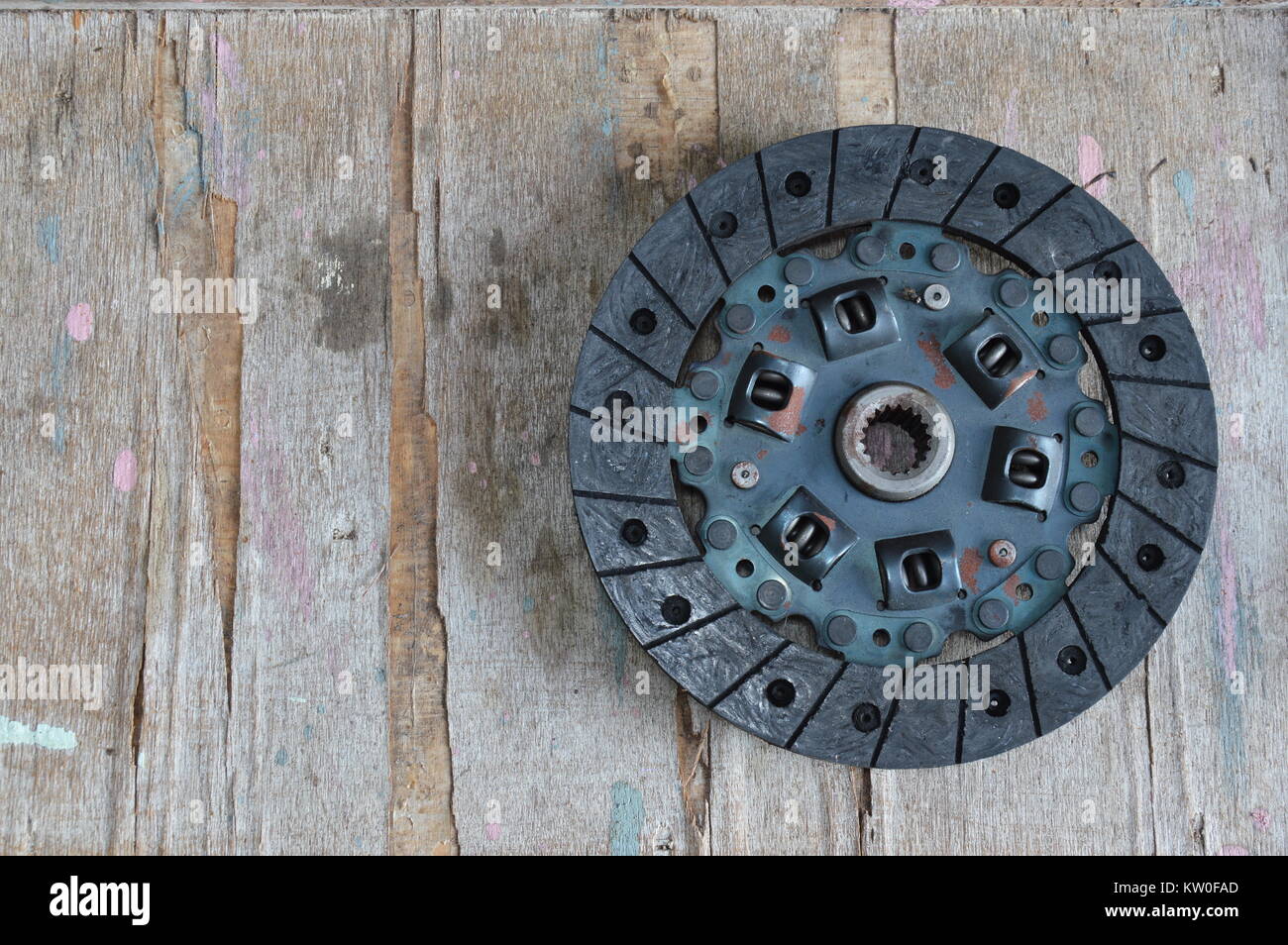broken engine clutch on wood board Stock Photo Alamy