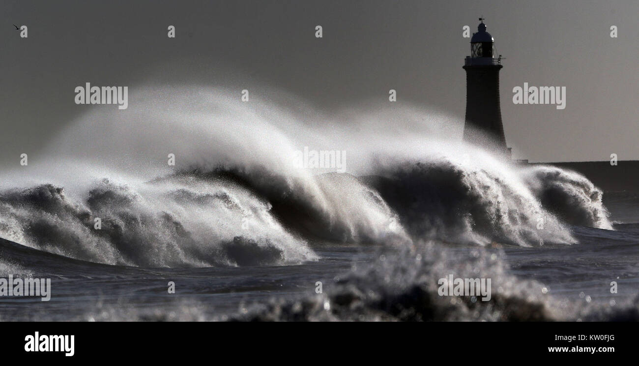Rough seas off the beach at Tynemouth with the lighthouse of the town's North Pier in the background. PRESS AASSOCIATION Photo. Picture date: Thursday December 28, 2017. See PA story WEATHER Icy. Photo credit should read: Owen Humphreys/PA Wire Stock Photo