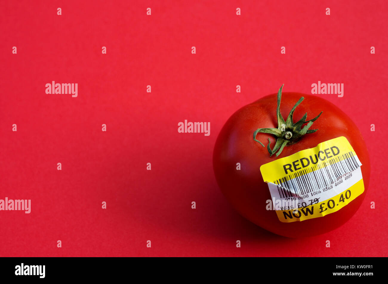 Reduced price tomato Stock Photo