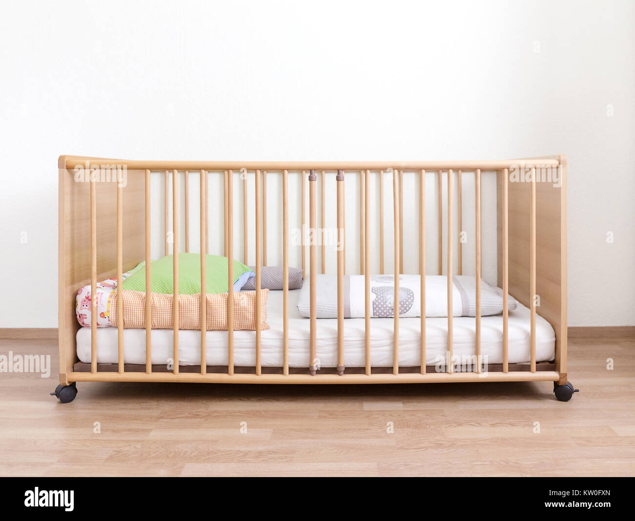wooden cot with mattress