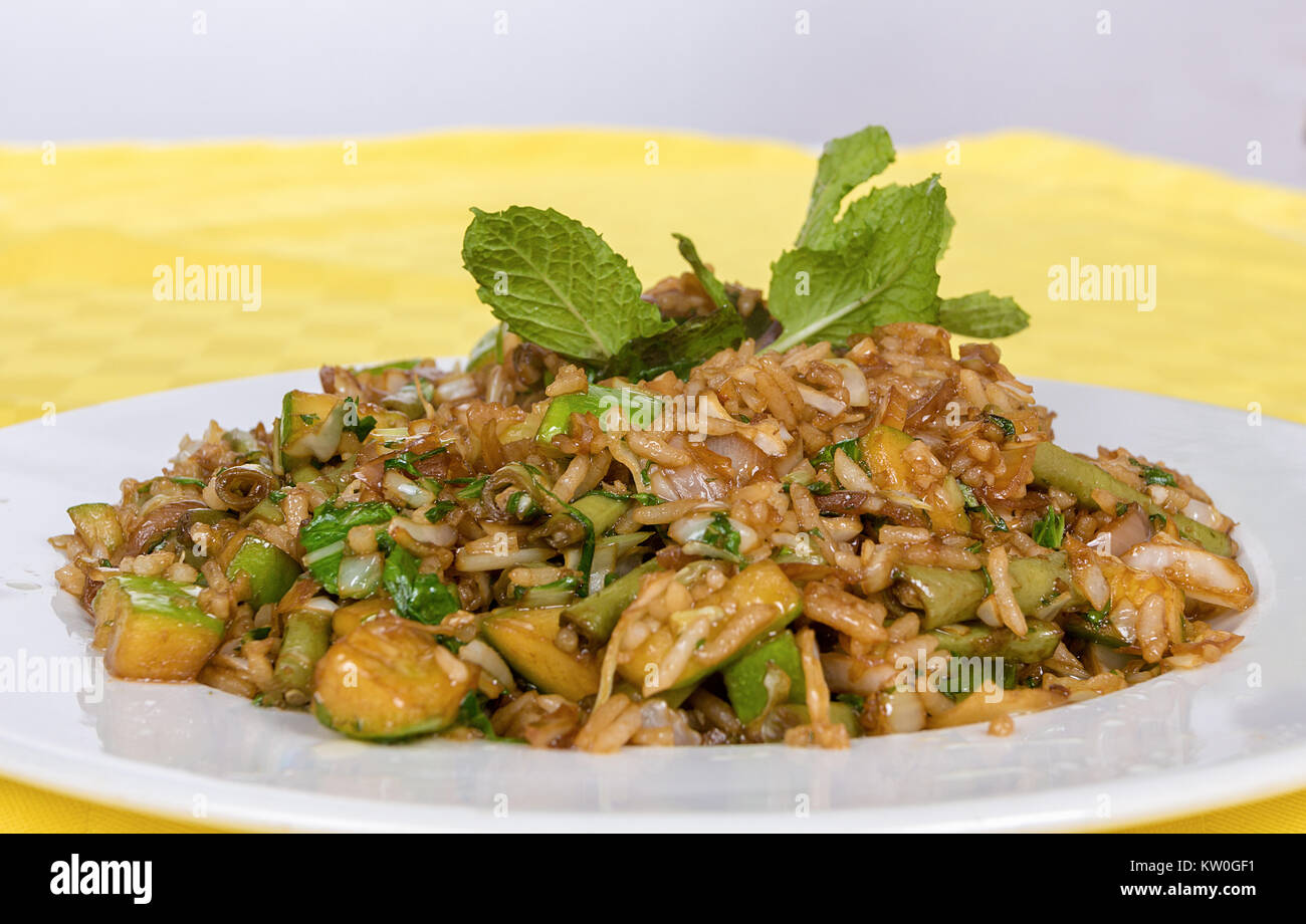A picture of a white dish served with rice with vagatables Stock Photo
