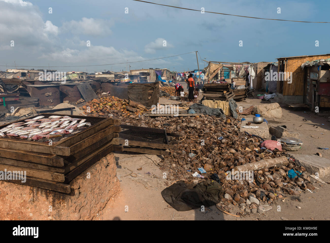 Smoking fish over a clay oven, Jamestown Fishing Village, Jamestown
