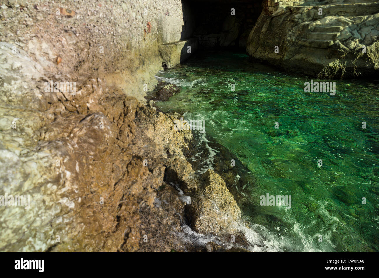 Small sea cave in Split, Croatia Stock Photo