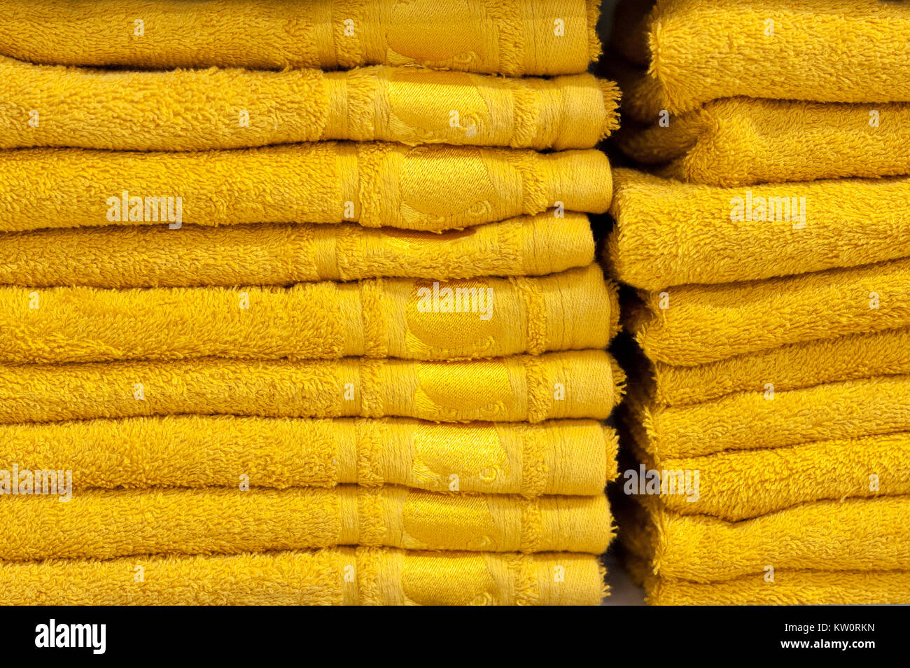 bath towels of bright colors in a row in a row on the counter of a