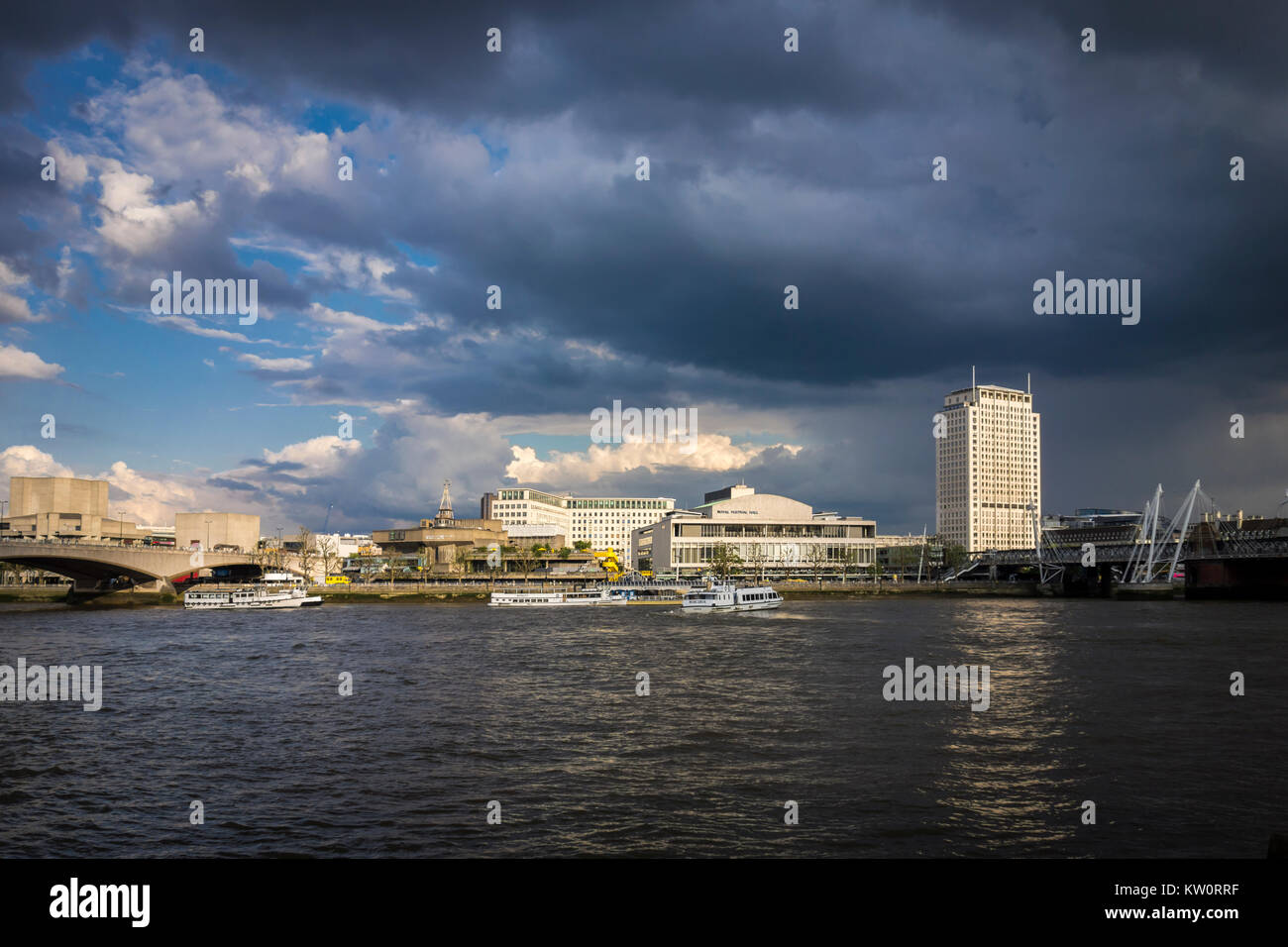 Heavy clouds over London Southbank with the River Thames, Shell Centre Tower, Royal Festival Hall & Waterloo Bridge. London, UK Stock Photo