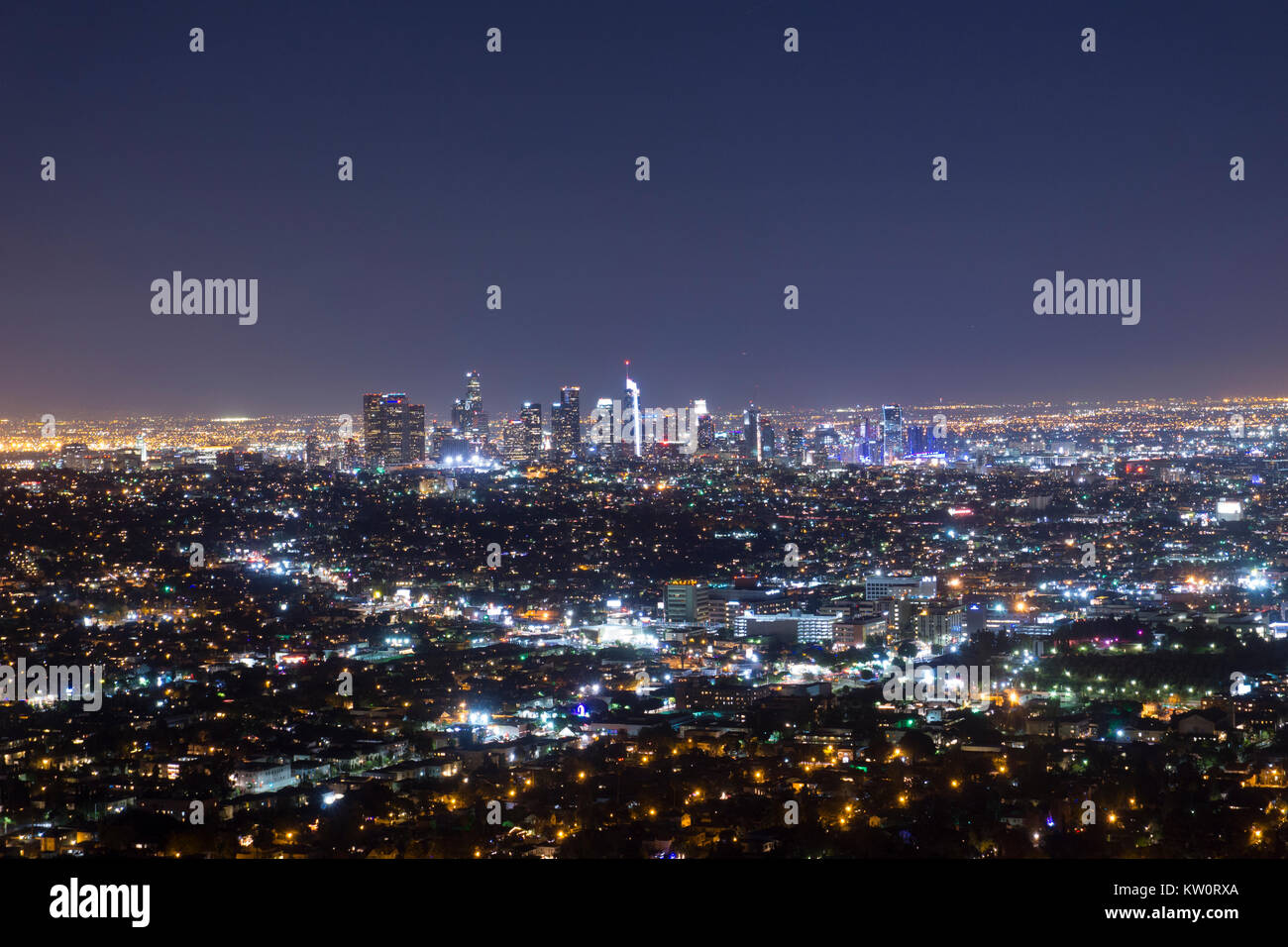 Griffith Observatory City Night View of Downtown Los Angeles. Beautiful view of Staple Center LA Live city skyline with the city lights twinkling LOVE Stock Photo