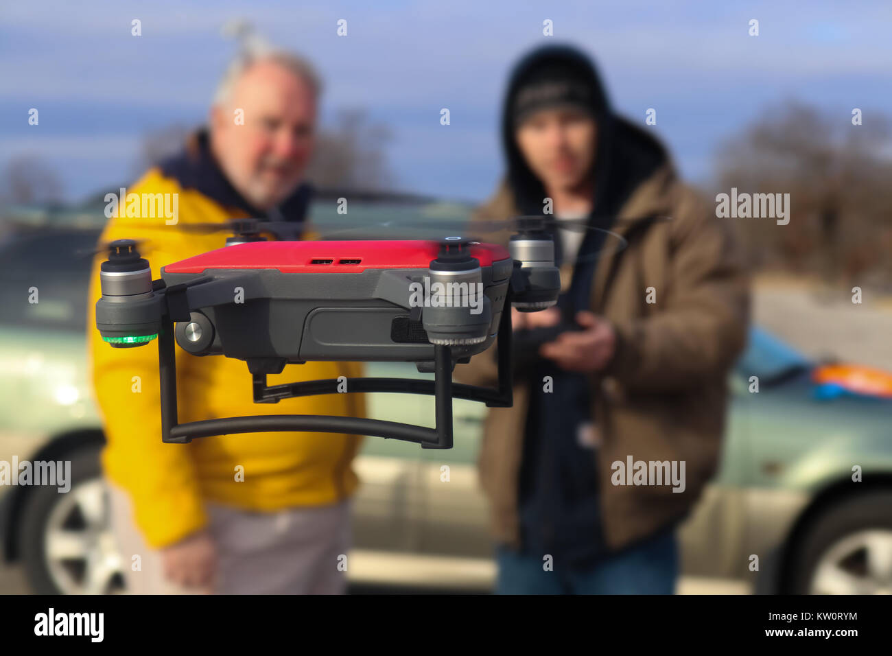 Father and son flying a DJI Spark drone Tulsa Oklahoma USA 12 - 28 - 2017 Stock Photo