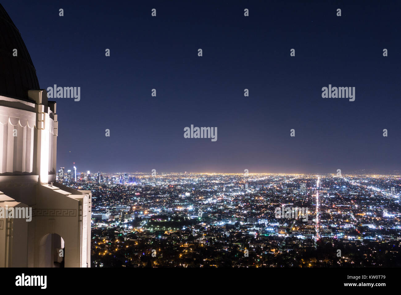 Night time Downtown Los Angeles City view Picture. Picture is taken from the Griffith Observatory with LA twinkling  in the distance. LA Live Staples Stock Photo